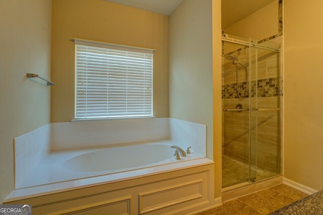 1186 Diamond Xing, Mcdonough, GA 30252 - bathroom featuring a bath and a stall shower
