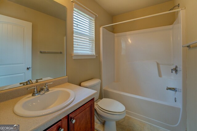 1186 Diamond Xing, Mcdonough, GA 30252 - bathroom with toilet, vanity, and shower / bath combination
