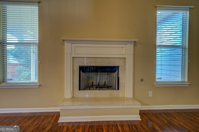 1186 Diamond Xing, Mcdonough, GA 30252 - detailed view of wood finished floors, baseboards, and a high end fireplace
