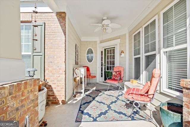 view of patio with ceiling fan and a porch