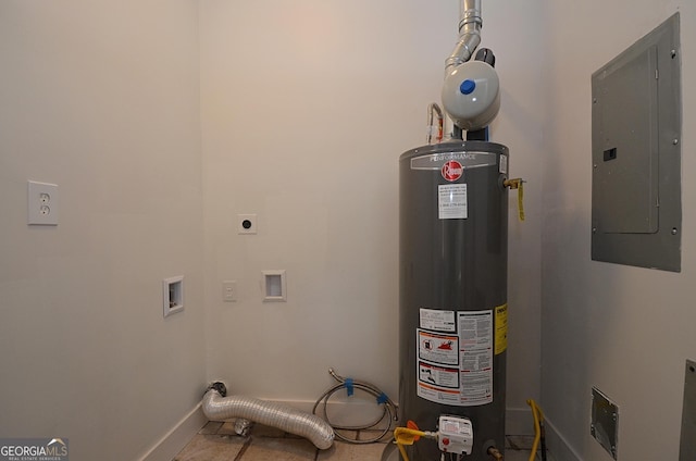 utility room featuring gas water heater and electric panel