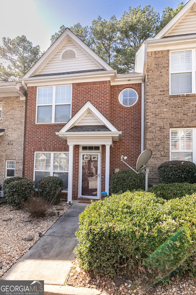 view of property with brick siding