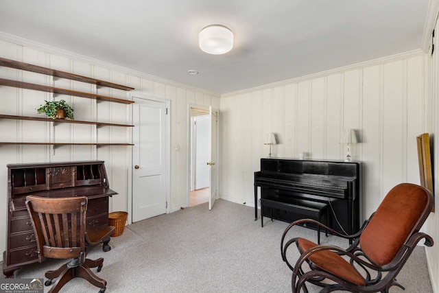 sitting room with light carpet and crown molding