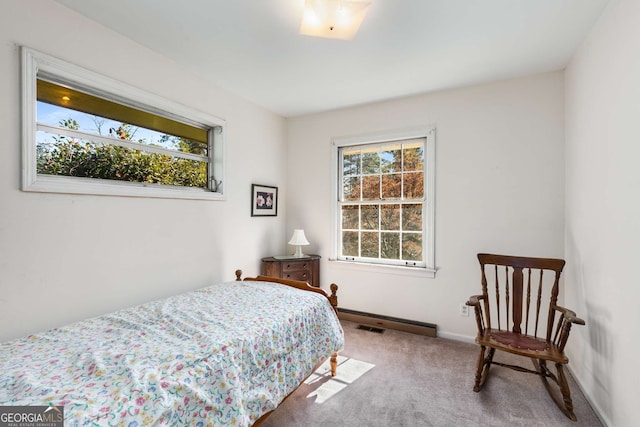 carpeted bedroom featuring visible vents and baseboards