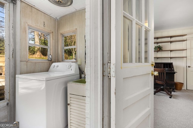 laundry room with laundry area, washer / clothes dryer, wood walls, and carpet