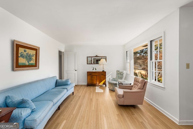 living room featuring light wood-style floors and baseboards