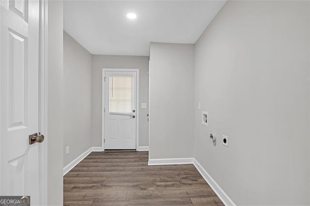 interior space featuring hookup for a washing machine, laundry area, dark wood-style flooring, baseboards, and electric dryer hookup