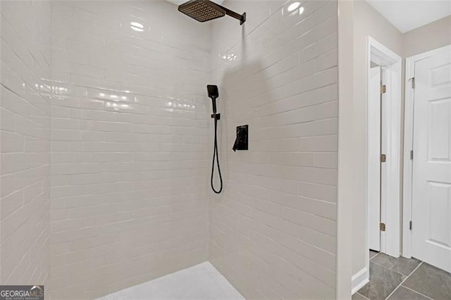 bathroom with a tile shower