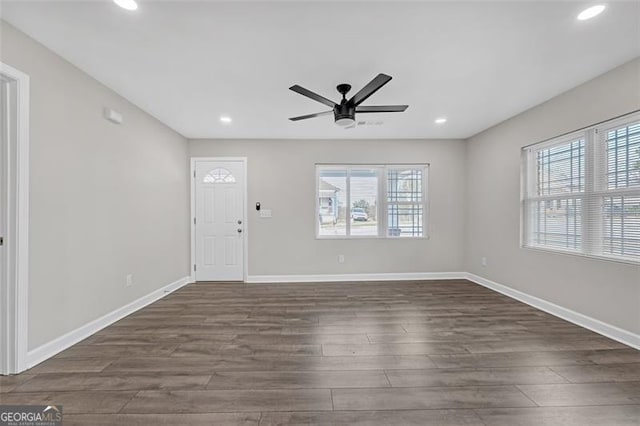 entryway with ceiling fan, recessed lighting, dark wood finished floors, and baseboards