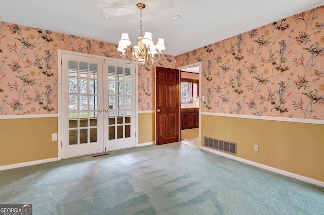 unfurnished dining area featuring french doors, visible vents, and wallpapered walls