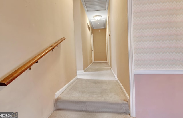 stairway featuring visible vents, carpet flooring, attic access, and baseboards