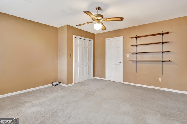 unfurnished bedroom with light carpet, ceiling fan, baseboards, and a closet