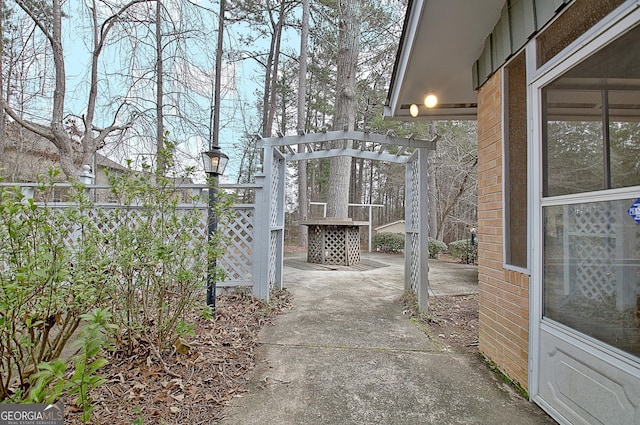 view of patio featuring fence