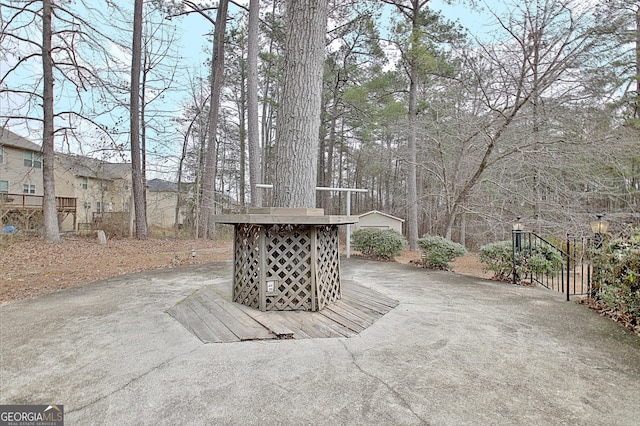 view of patio featuring an outbuilding