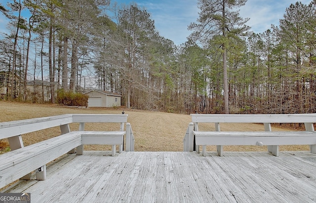 wooden terrace featuring an outdoor structure