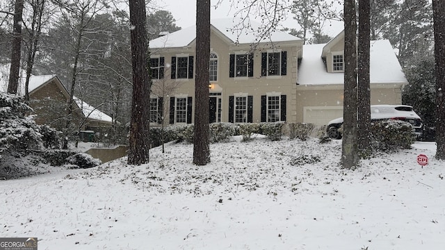 colonial home featuring a garage