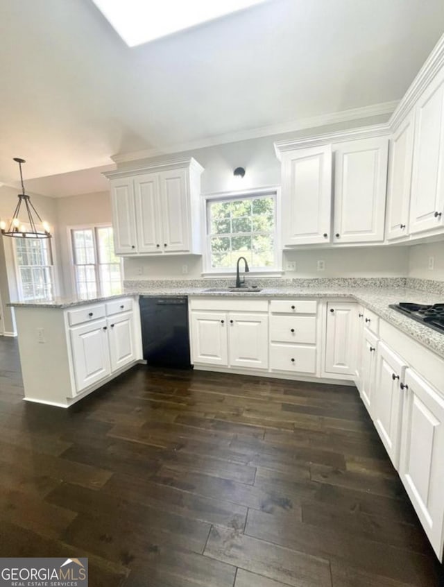 kitchen featuring a peninsula, black appliances, and white cabinets