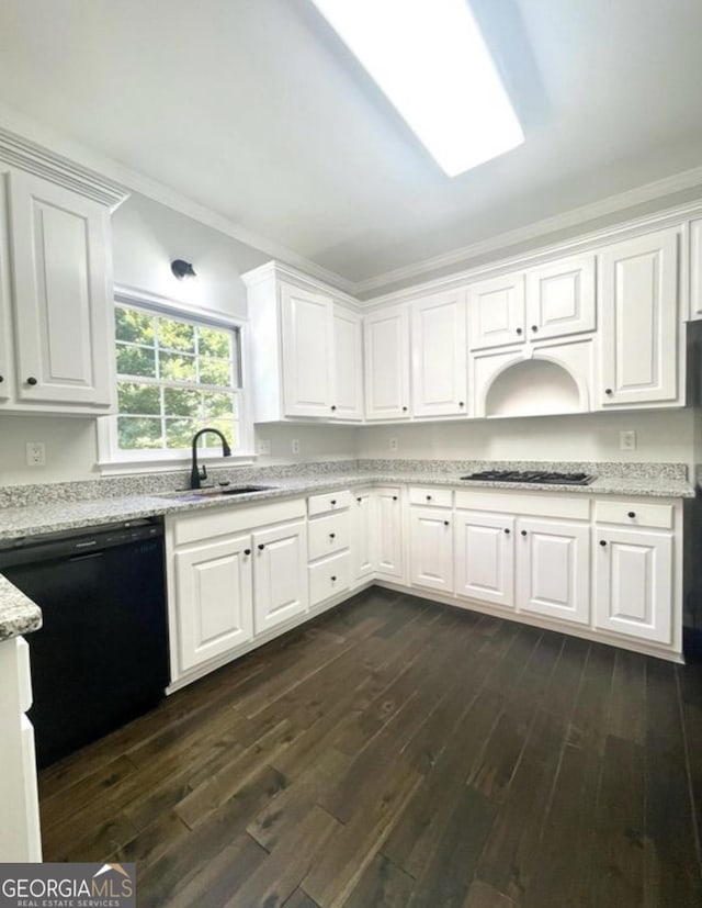 kitchen featuring dark wood-style floors, black dishwasher, ornamental molding, white cabinets, and a sink