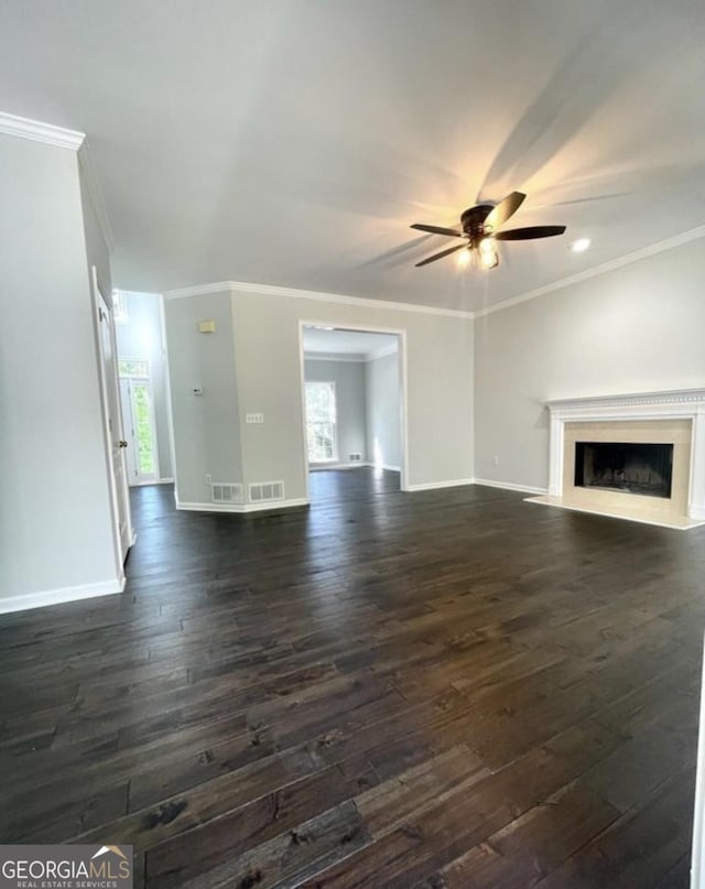 unfurnished living room featuring plenty of natural light, baseboards, and a fireplace with flush hearth