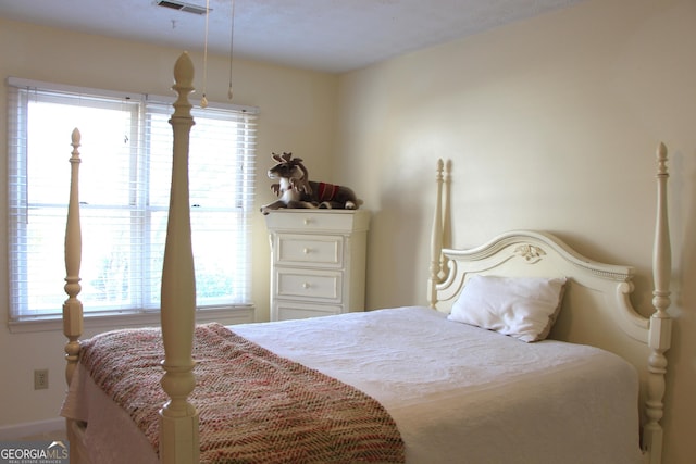 bedroom with visible vents