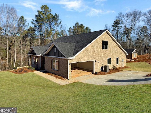 view of front of house with driveway, a shingled roof, cooling unit, a front lawn, and board and batten siding