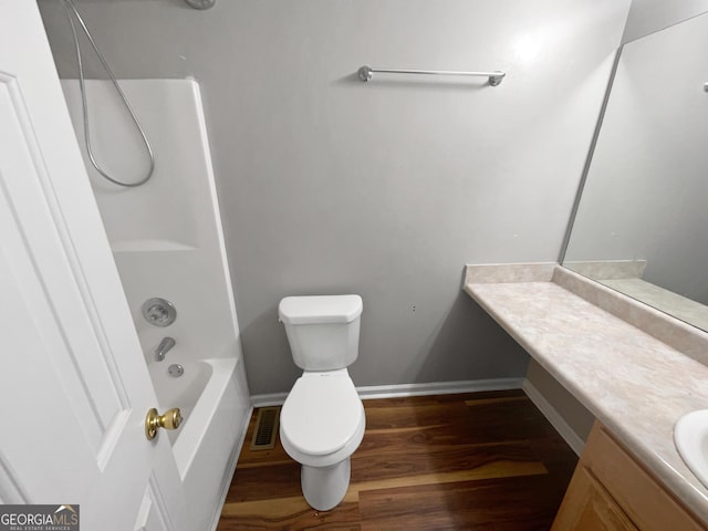 full bathroom featuring baseboards, visible vents, toilet, wood finished floors, and vanity