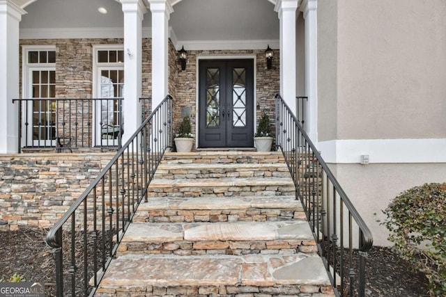 entrance to property featuring stone siding