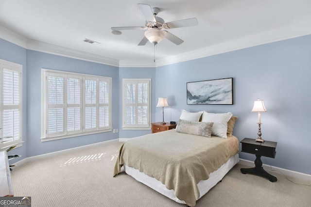 carpeted bedroom with baseboards, visible vents, ceiling fan, and ornamental molding