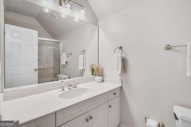 full bathroom with a stall shower, lofted ceiling, and toilet