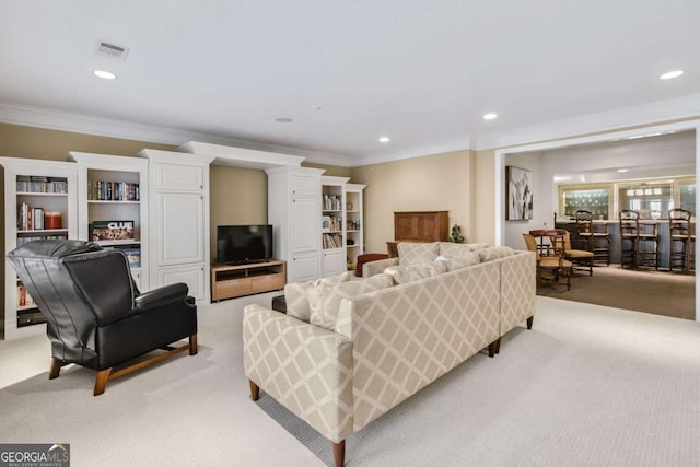 living room with crown molding, recessed lighting, visible vents, and light colored carpet