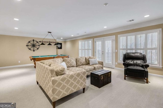 living area featuring light colored carpet, billiards, visible vents, baseboards, and ornamental molding