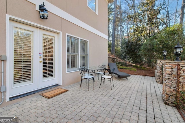 view of patio featuring french doors and outdoor dining area