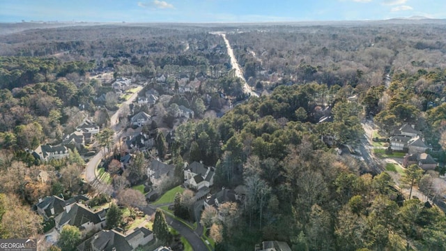 birds eye view of property featuring a residential view and a view of trees