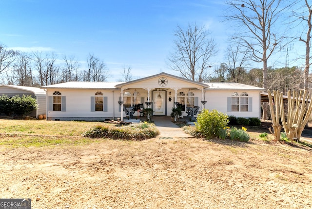 view of front of home with a porch, crawl space, and a front yard