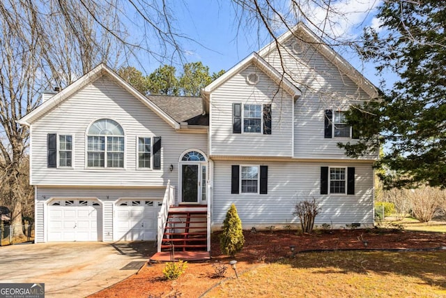 split level home featuring a garage and driveway