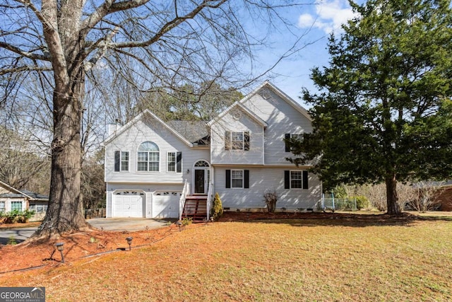 view of front of house featuring driveway, crawl space, a garage, and a chimney