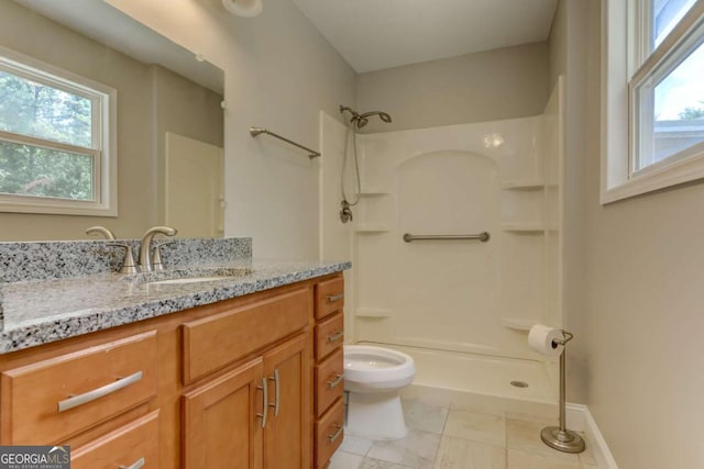 full bathroom featuring toilet, walk in shower, a wealth of natural light, and vanity