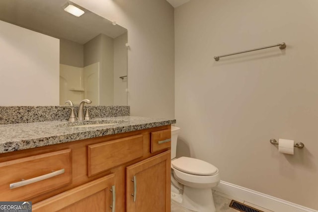 bathroom featuring visible vents, baseboards, toilet, tile patterned flooring, and vanity