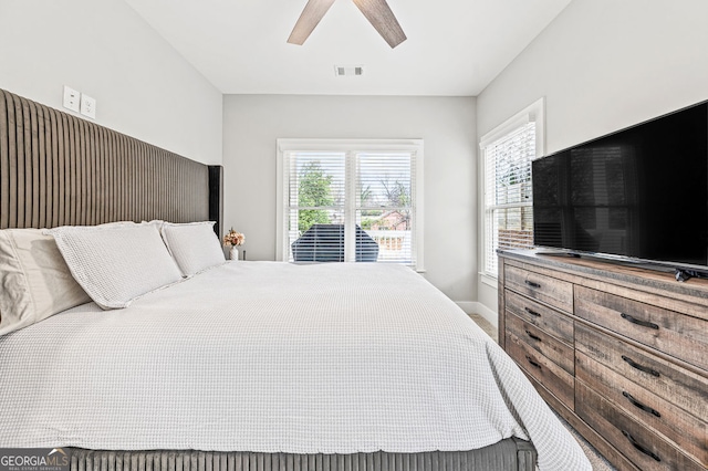 bedroom with visible vents, ceiling fan, and baseboards