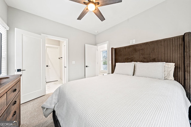 bedroom featuring light carpet and a ceiling fan