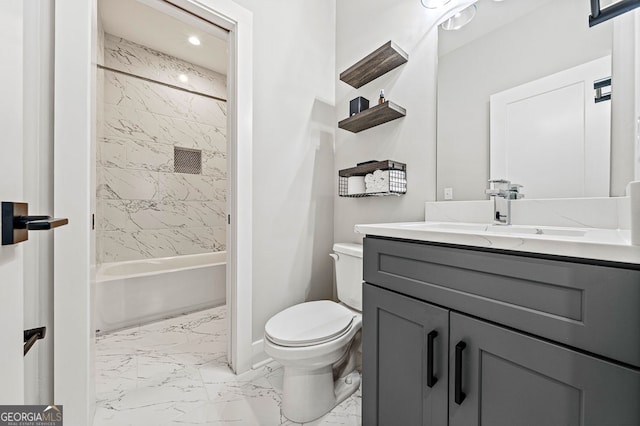 bathroom with marble finish floor, toilet, vanity, shower / tub combination, and baseboards