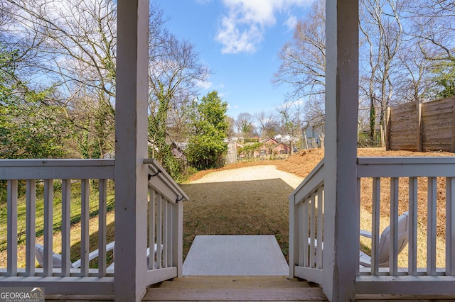 view of yard with fence and a deck