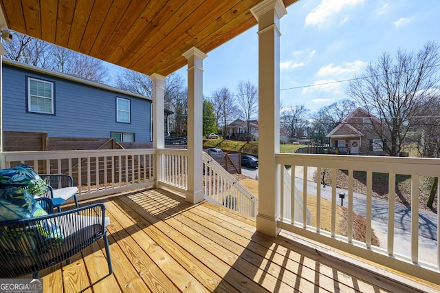 wooden terrace featuring a residential view