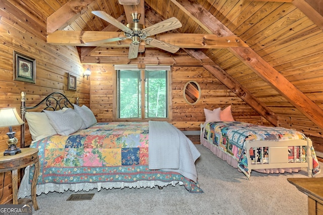 bedroom featuring lofted ceiling with beams, wooden ceiling, wood walls, carpet flooring, and visible vents