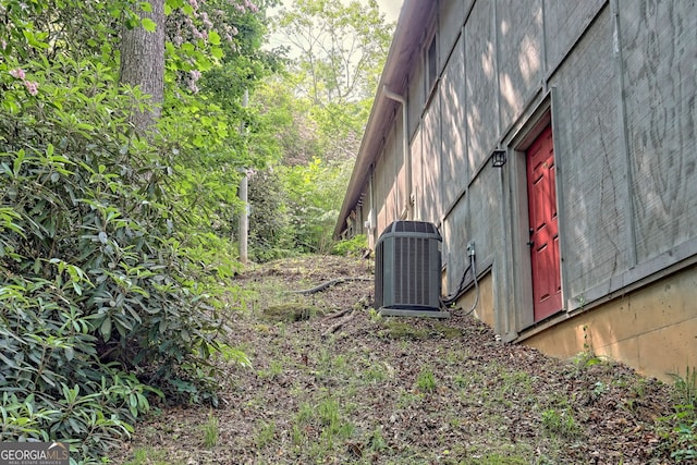 view of storm shelter with central AC unit