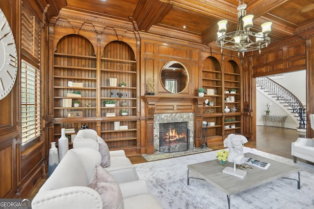 440 Belada Blvd, Sandy Springs, GA 30342 - living room featuring a wooden ceiling with exposed beams, built in features, a chandelier, ornamental molding, and coffered ceiling