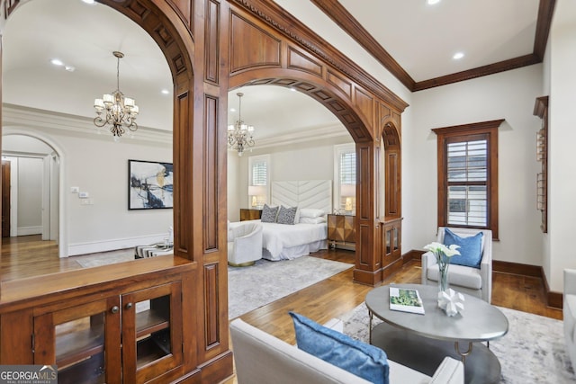 440 Belada Blvd, Sandy Springs, GA 30342 - bedroom with arched walkways, a chandelier, ornamental molding, wood finished floors, and recessed lighting