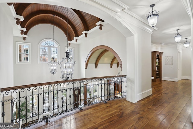 440 Belada Blvd, Sandy Springs, GA 30342 - hallway with a chandelier, hardwood / wood-style floors, arched walkways, and lofted ceiling