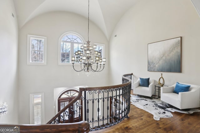 440 Belada Blvd, Sandy Springs, GA 30342 - hall with a chandelier, wood finished floors, an upstairs landing, and high vaulted ceiling