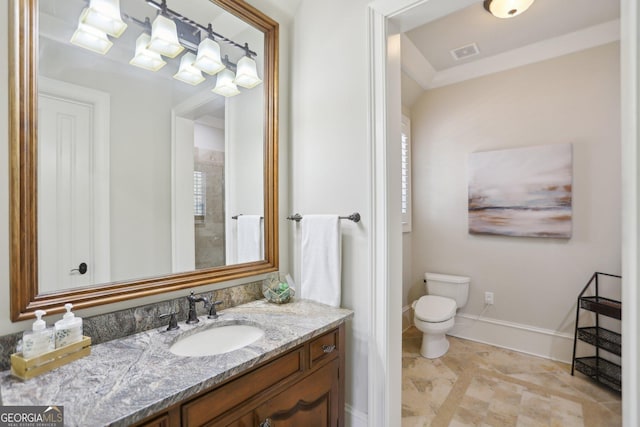 bathroom featuring baseboards, visible vents, vanity, and toilet